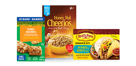 This image contains three products in boxes from IGA: Peanut Arachides, Honey-Nut Cheerios, and Old El Paso dinner kit.